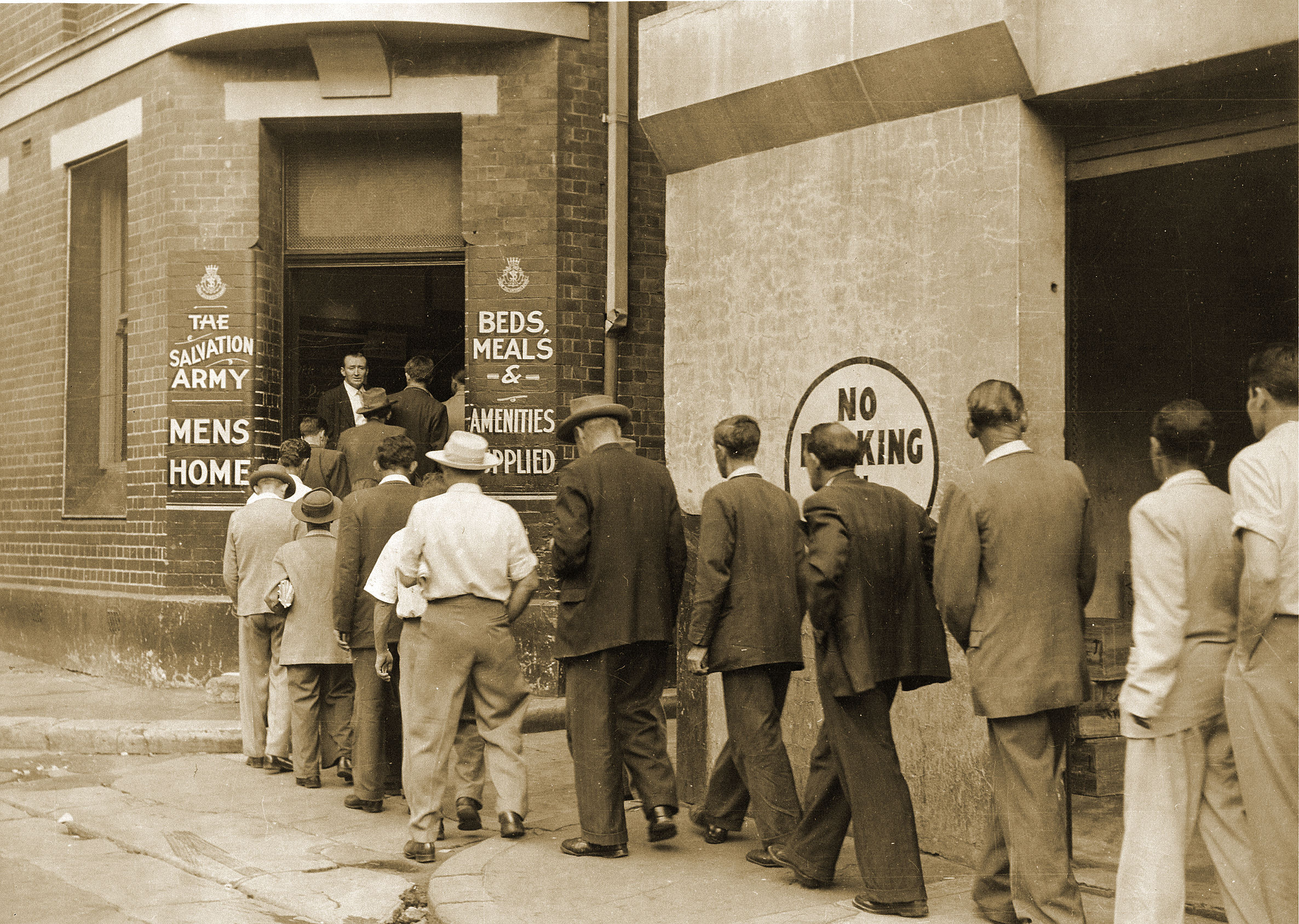 Men line up outside The Salvation Army's Foster House